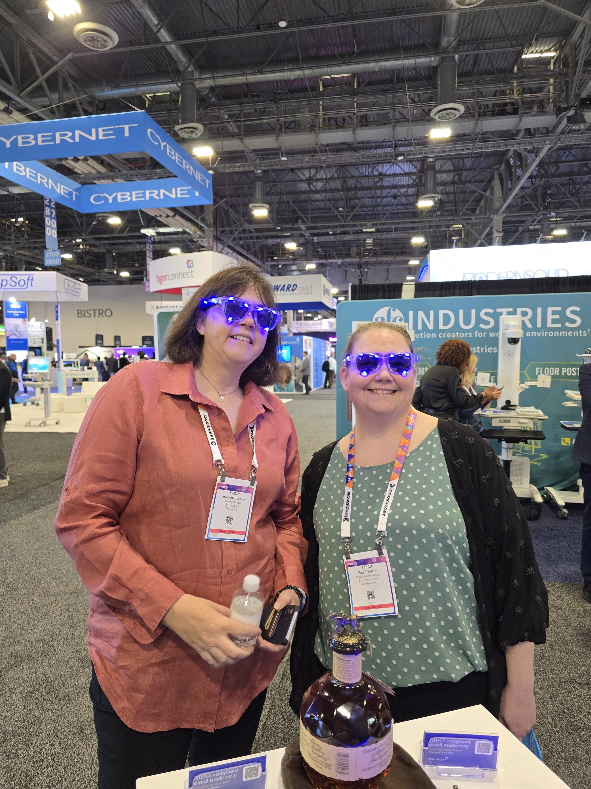 Two women with flashing sunglasses