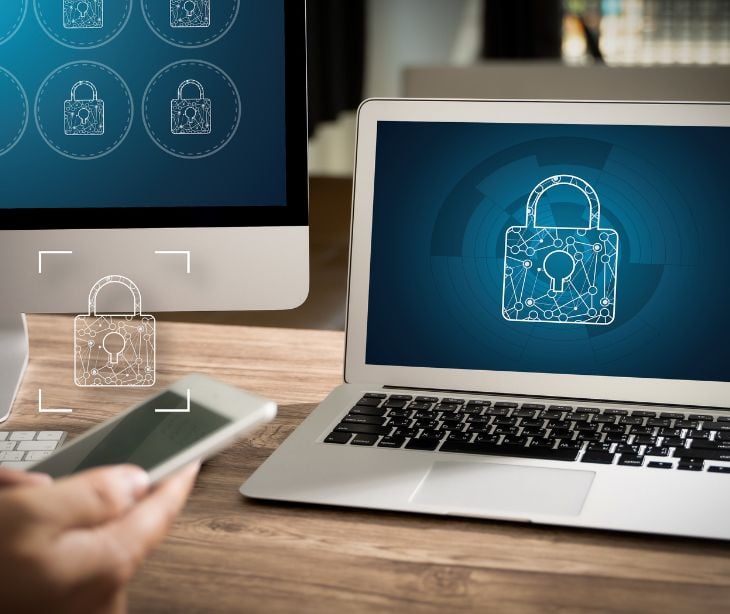 desktop, laptop and phone with blue lock icon on screen