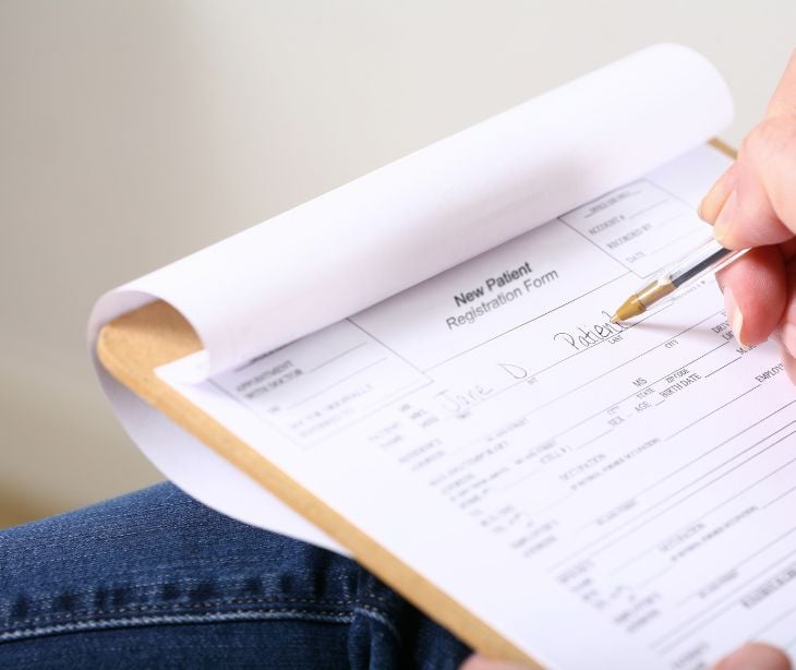 patient filling out paperwork