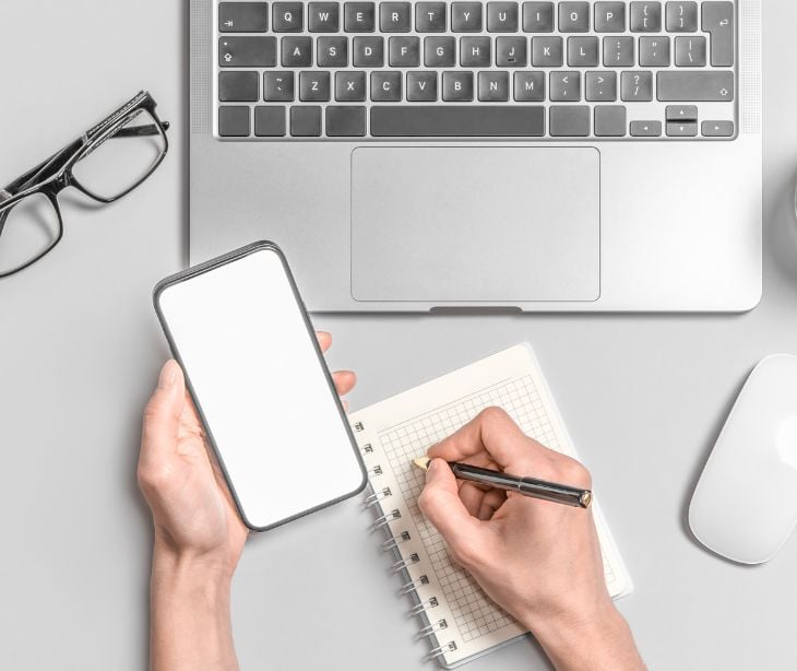 using smartphone at a desk