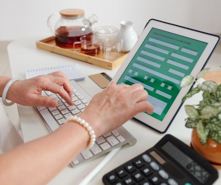 woman filling form on tablet