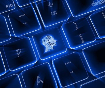 glowing blue digital keyboard with AI head symbol