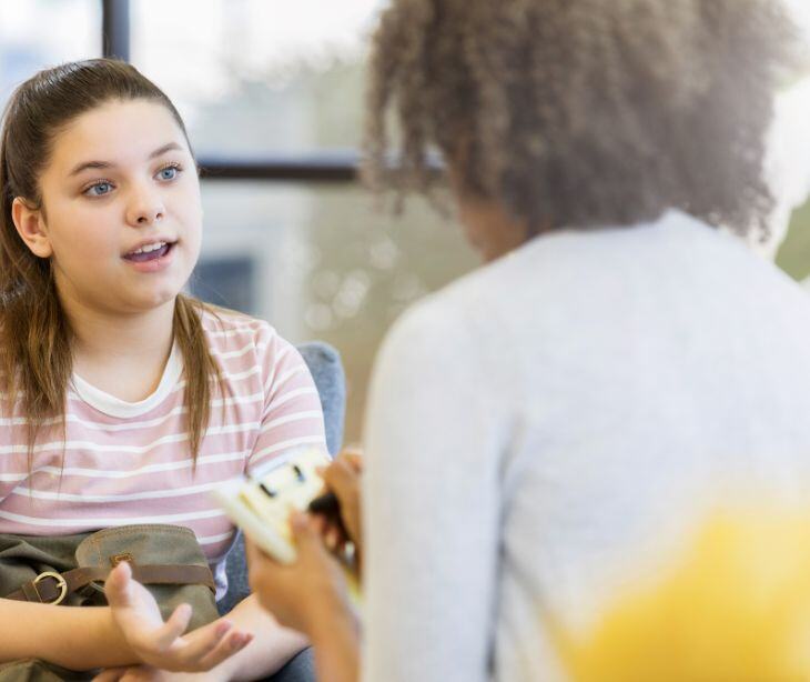 school counselor talking with student