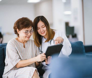 provider with patient using tablet