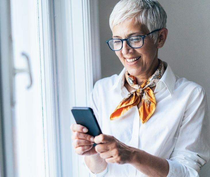 woman on phone for post Features of a HIPAA compliant text messaging platform 