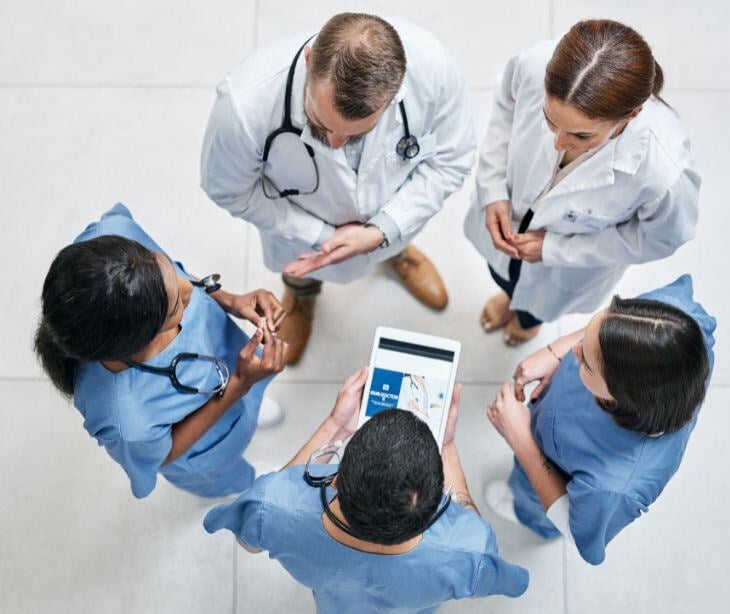 medical team standing in circle for post HIPAA compliant email for integrated care team communication 