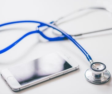 phone and stethoscope for post HIPAA compliant text messaging for communication challenges in healthcare