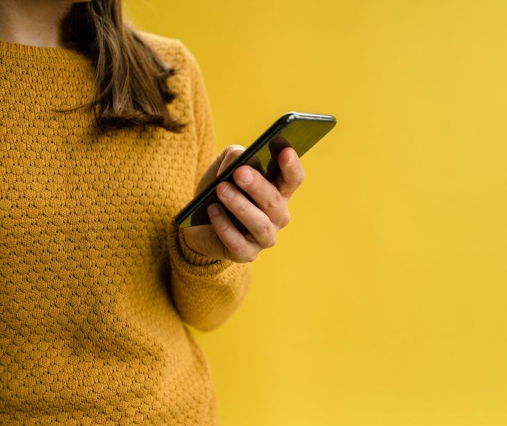 woman holding smartphone