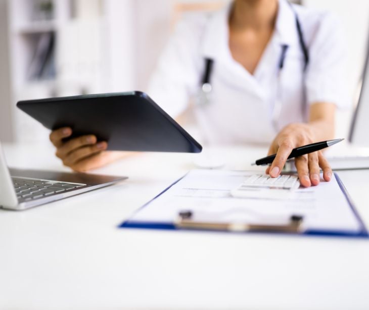 healthcare worker holding clipboard