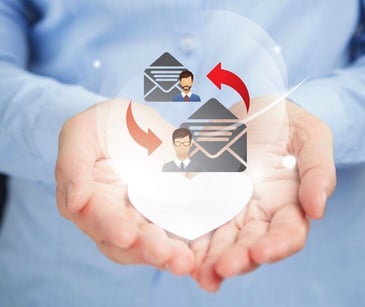 email and people icons in hands holding