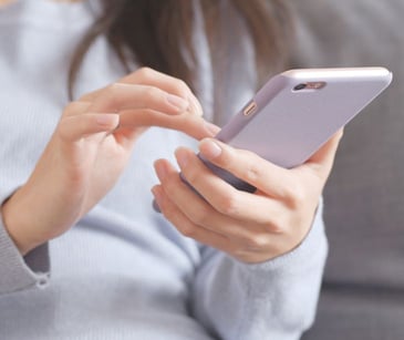 woman holding smartphone