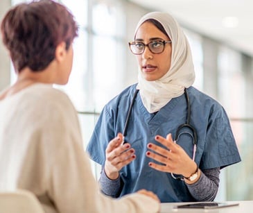 female doctor with female patient for post Improving women's access to equitable healthcare