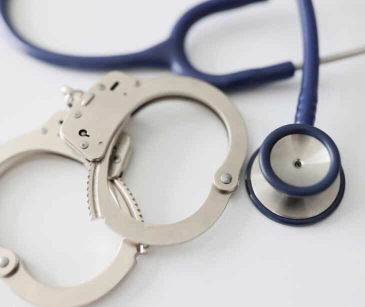 handcuffs with stethoscope