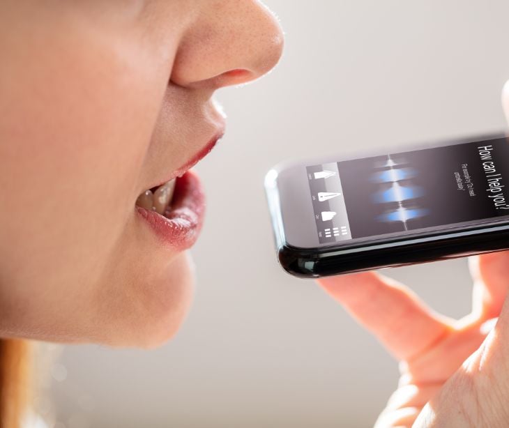 woman speaking into smartphone