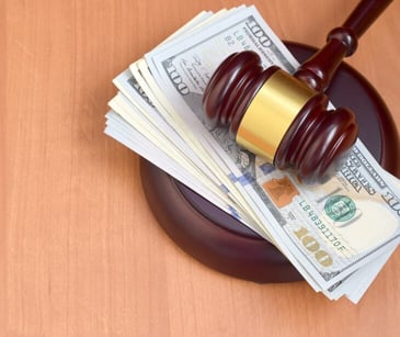 Image of gavel and money for blog about Lesson learned from the HHS settlement with Northeast Surgical Groups