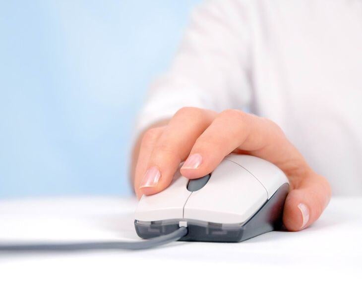 hand on mouse for post Managing patient unsubscribes in HIPAA email campaigns