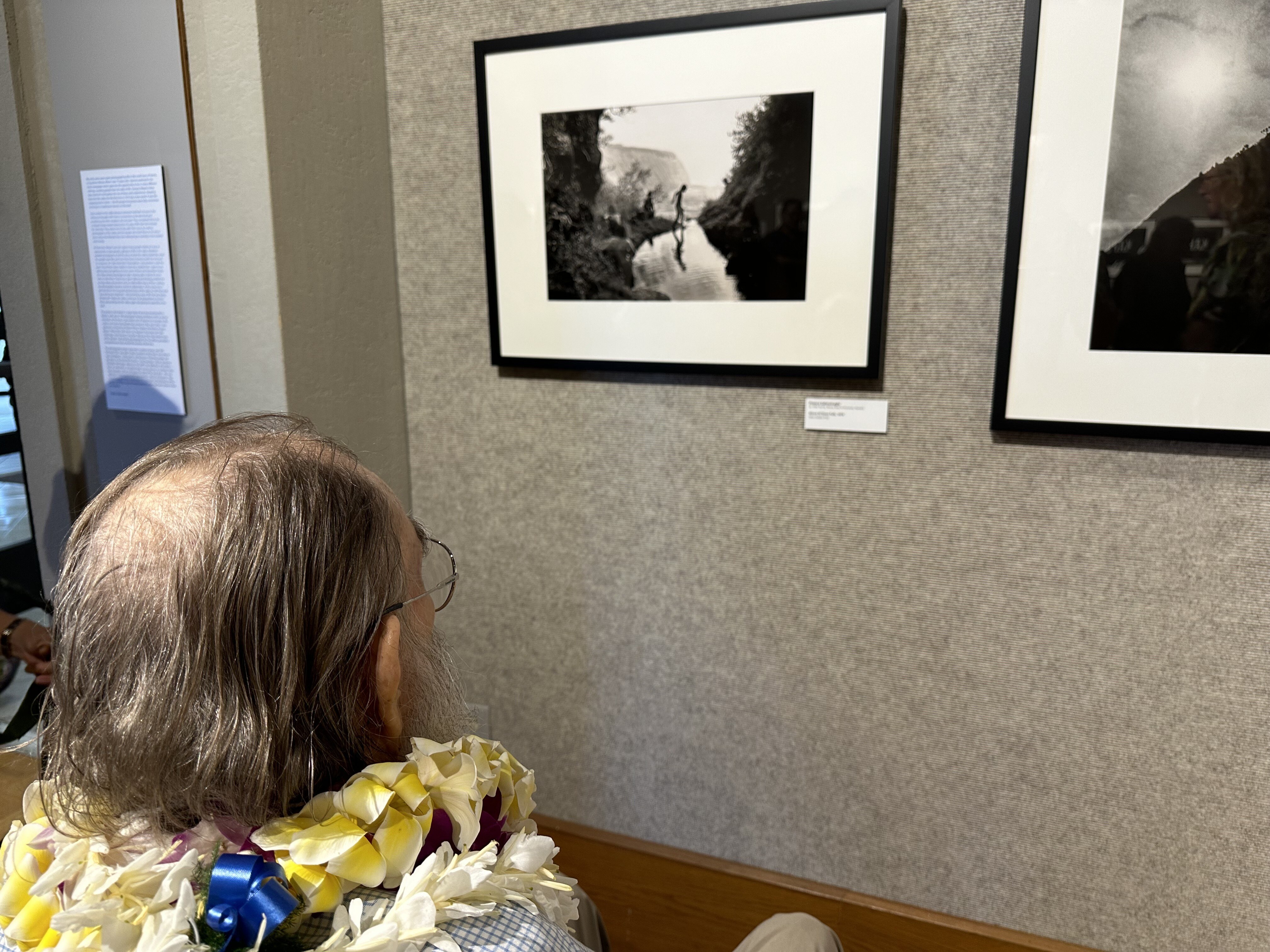 Ed Greevy admiring the work of Franco Salmoiraghi | Opening night: OG photogs at Windward Community College