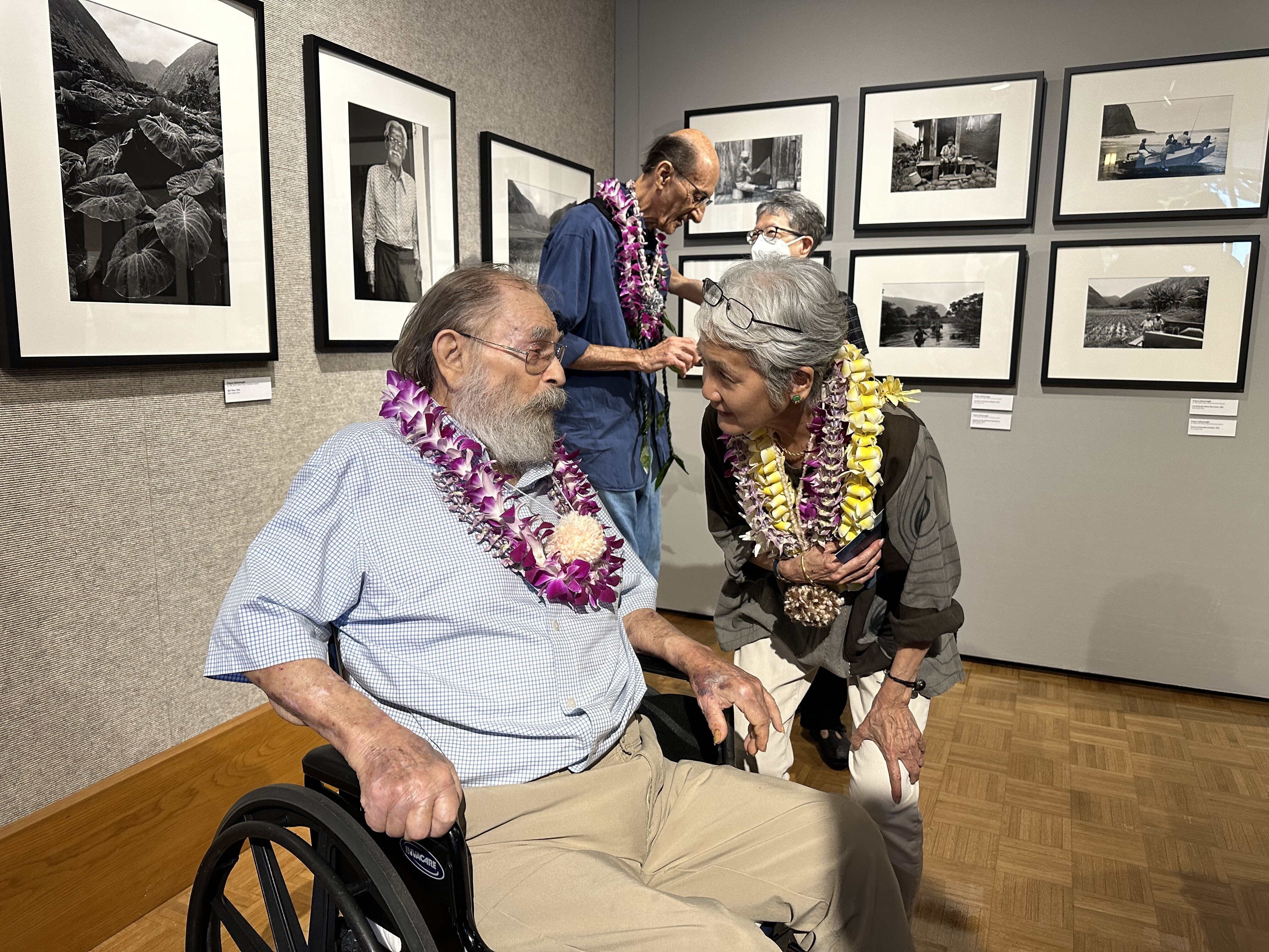 Ed Greevy catching up with Karen Kosasa | Opening night: OG photogs at Windward Community College