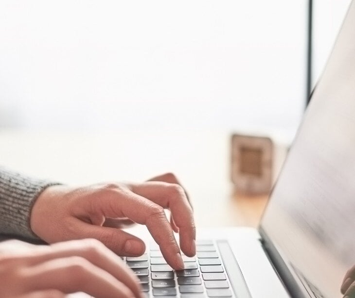 Image of someone typing on a computer for article about HIPAA compliant forms and psychiatric advance directives 