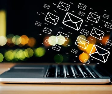 Image of computer with email emoticons for blog about Tips for choosing a HIPAA compliant email marketing provider