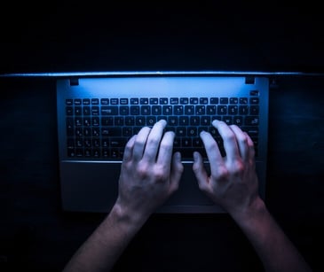 Image of someone typing for blog about What is the dark web?