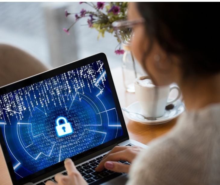 woman on computer with blue security lock on screen