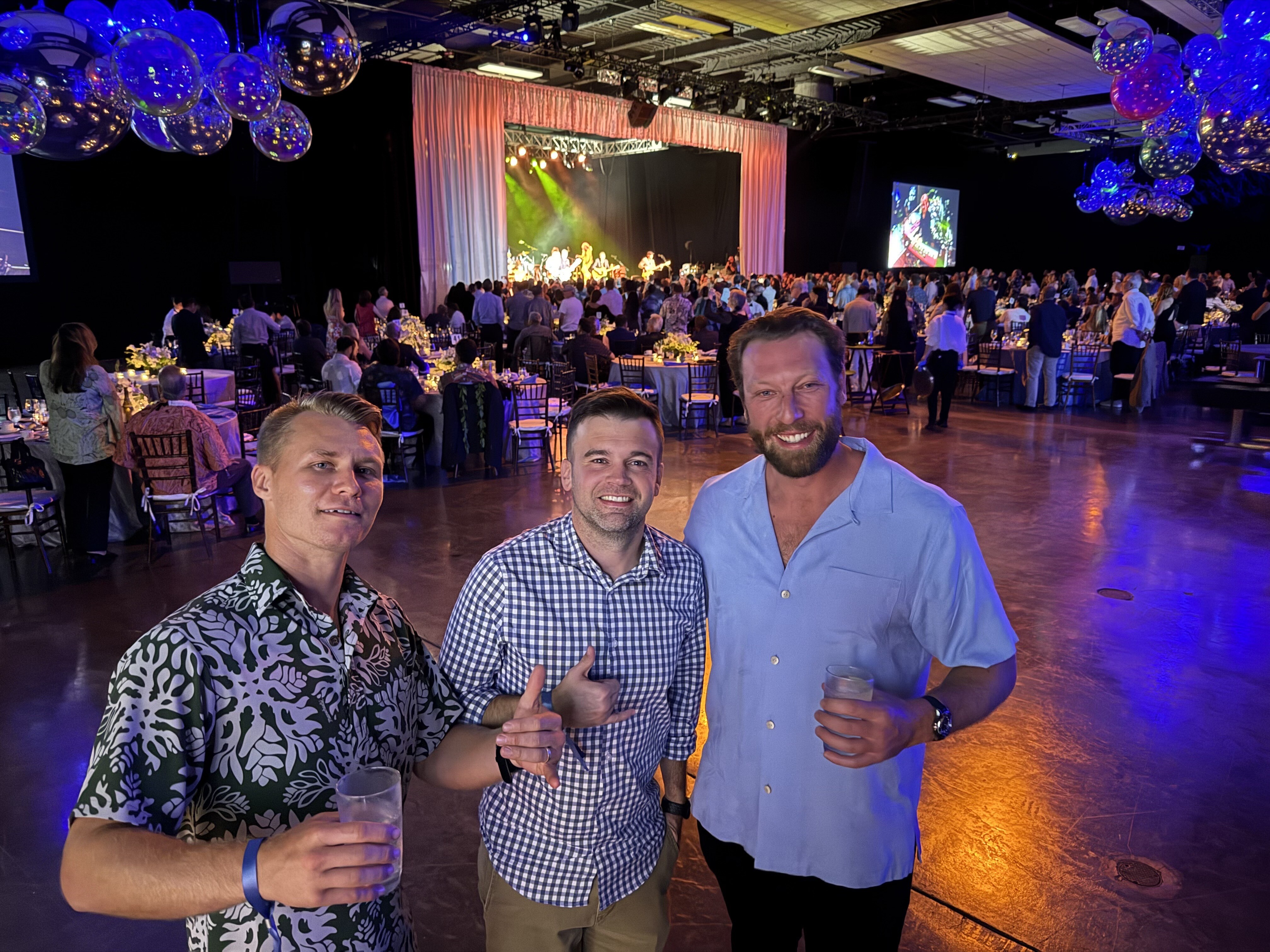 Mountan Mitchell, Jordan Holmes, and Greg Hoffman with Kenny Loggins in the back