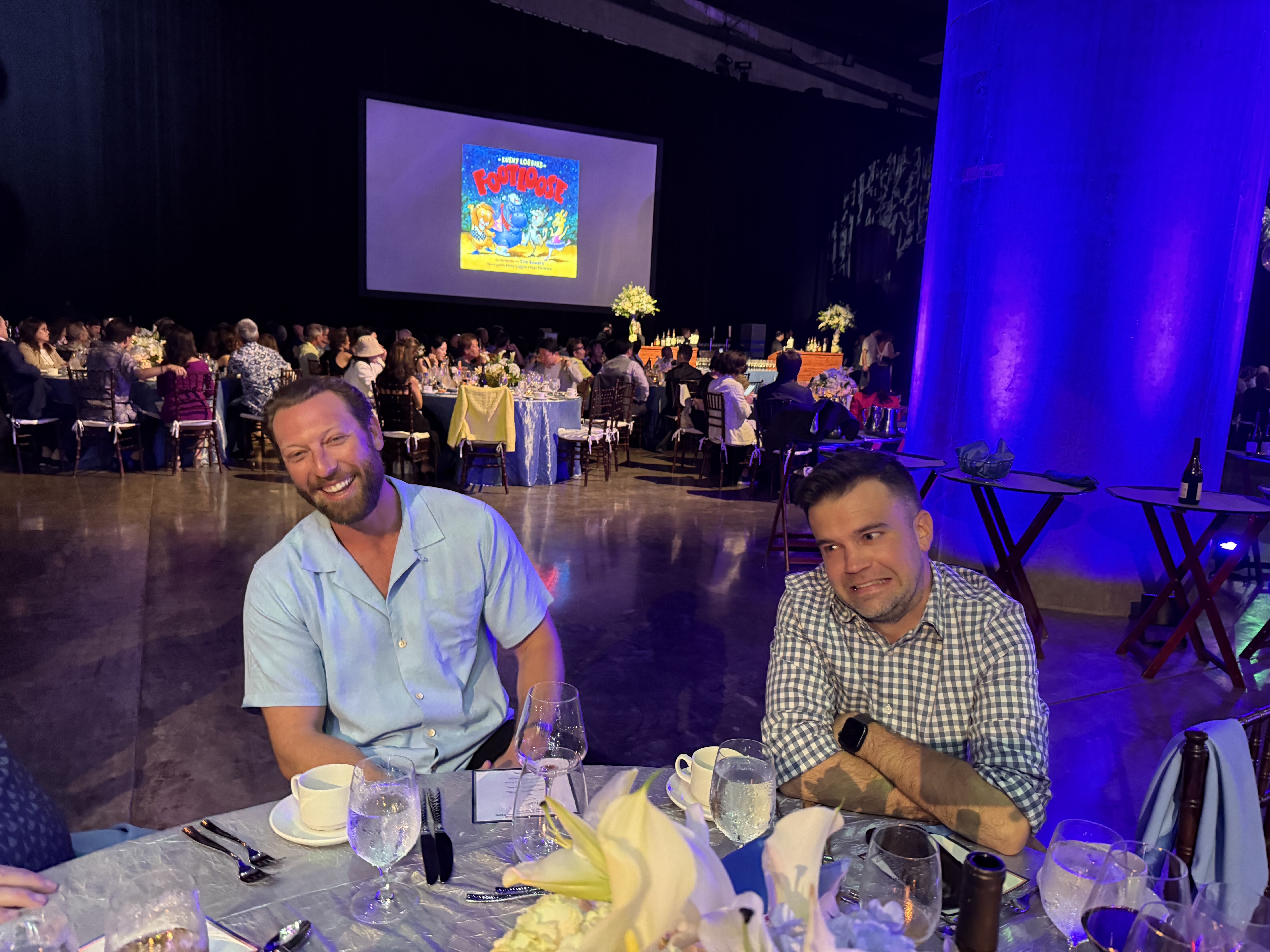 Greg Hoffman (left) and Jordan Holmes discussing how many posters of Kenny Loggins they had on their walls growing up