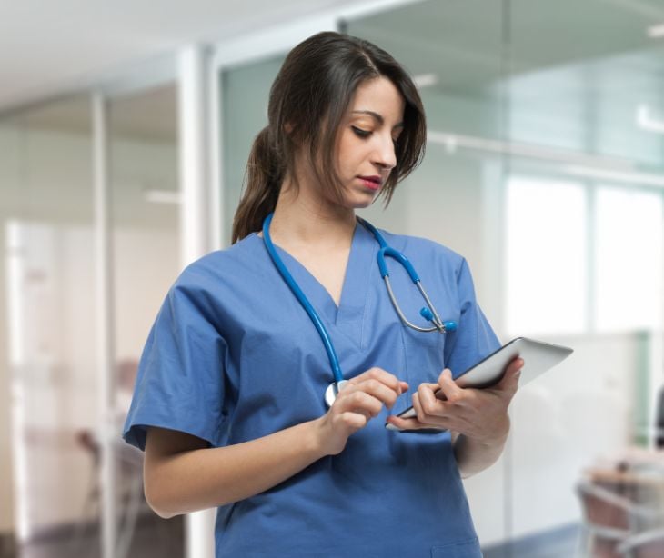 clinician holding a tablet