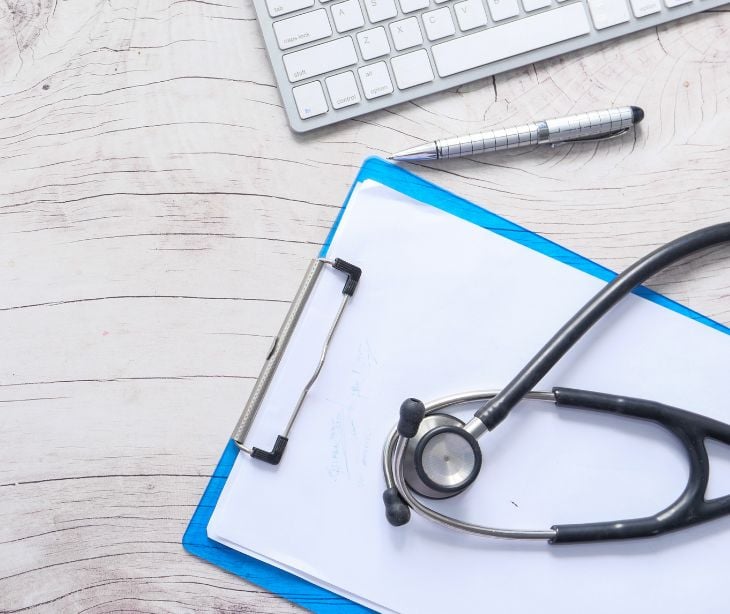 keyboard stethoscope and clipboard