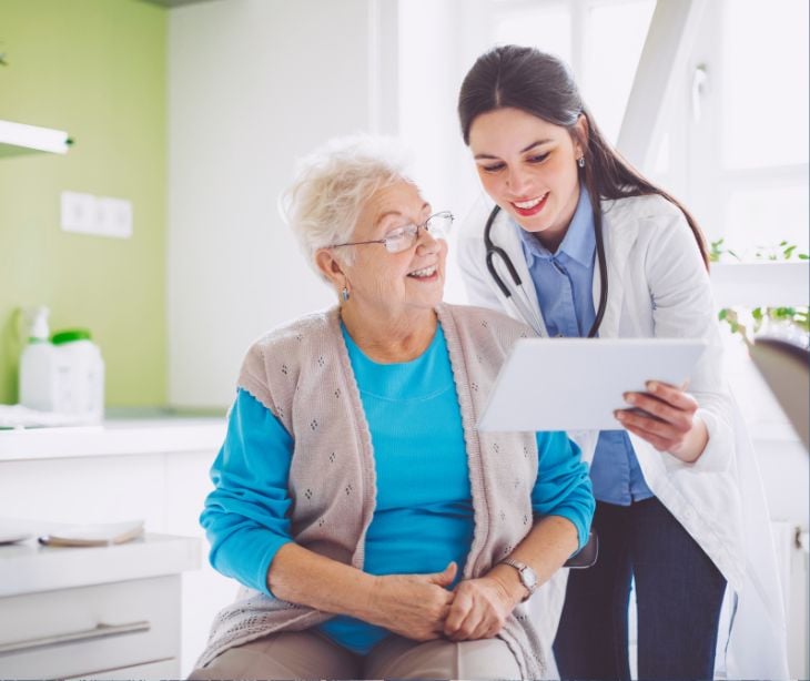 provider with patient with tablet