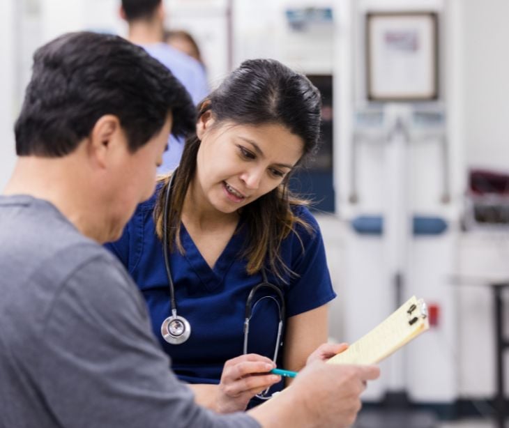 provider with patient signing paperwork