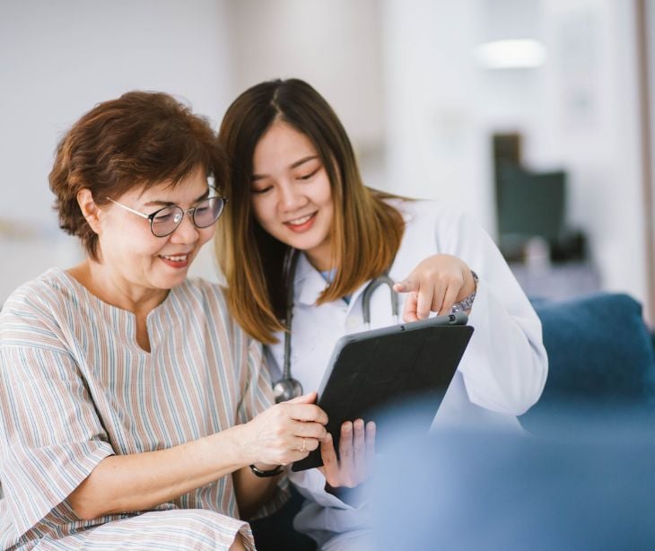 provider and patient looking over tablet