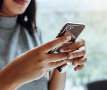 woman holding smartphone