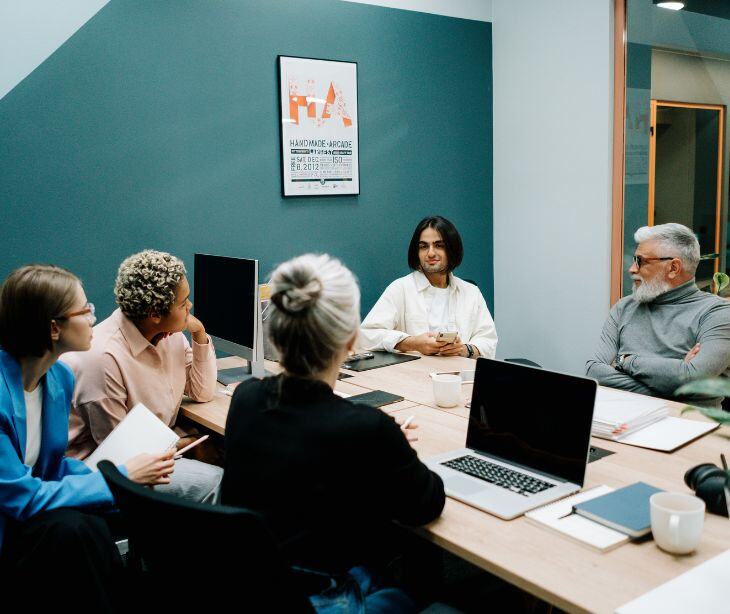 group of staff near computers