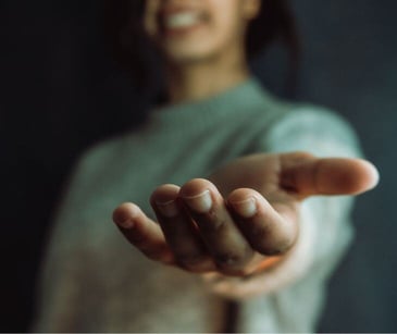 woman reaching out hand