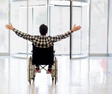 patient in wheelchair leaving hospital