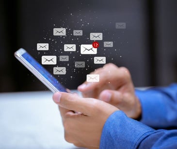 hand holding phone with text icons for post Using HIPAA compliant text messaging to track Alzheimer's progression