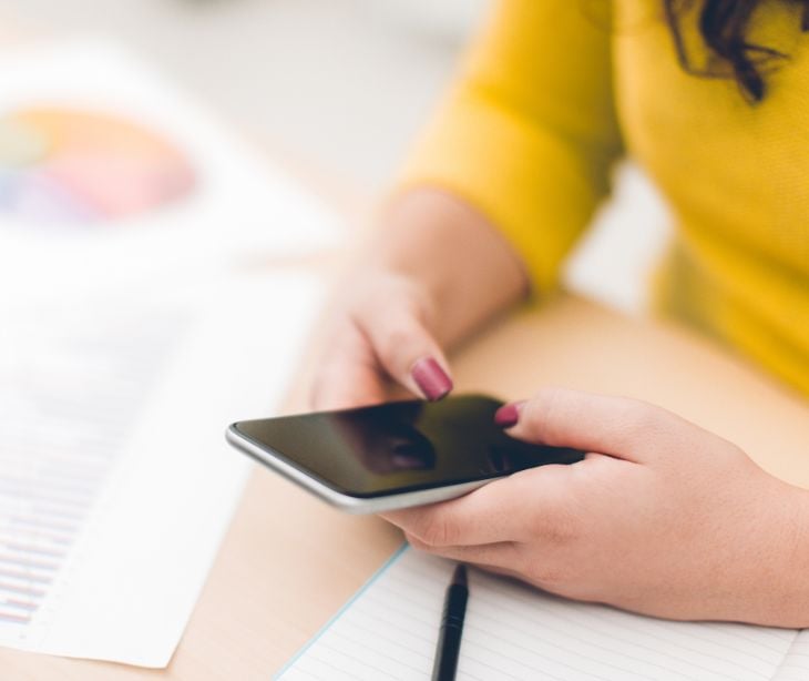 woman texting on smartphone