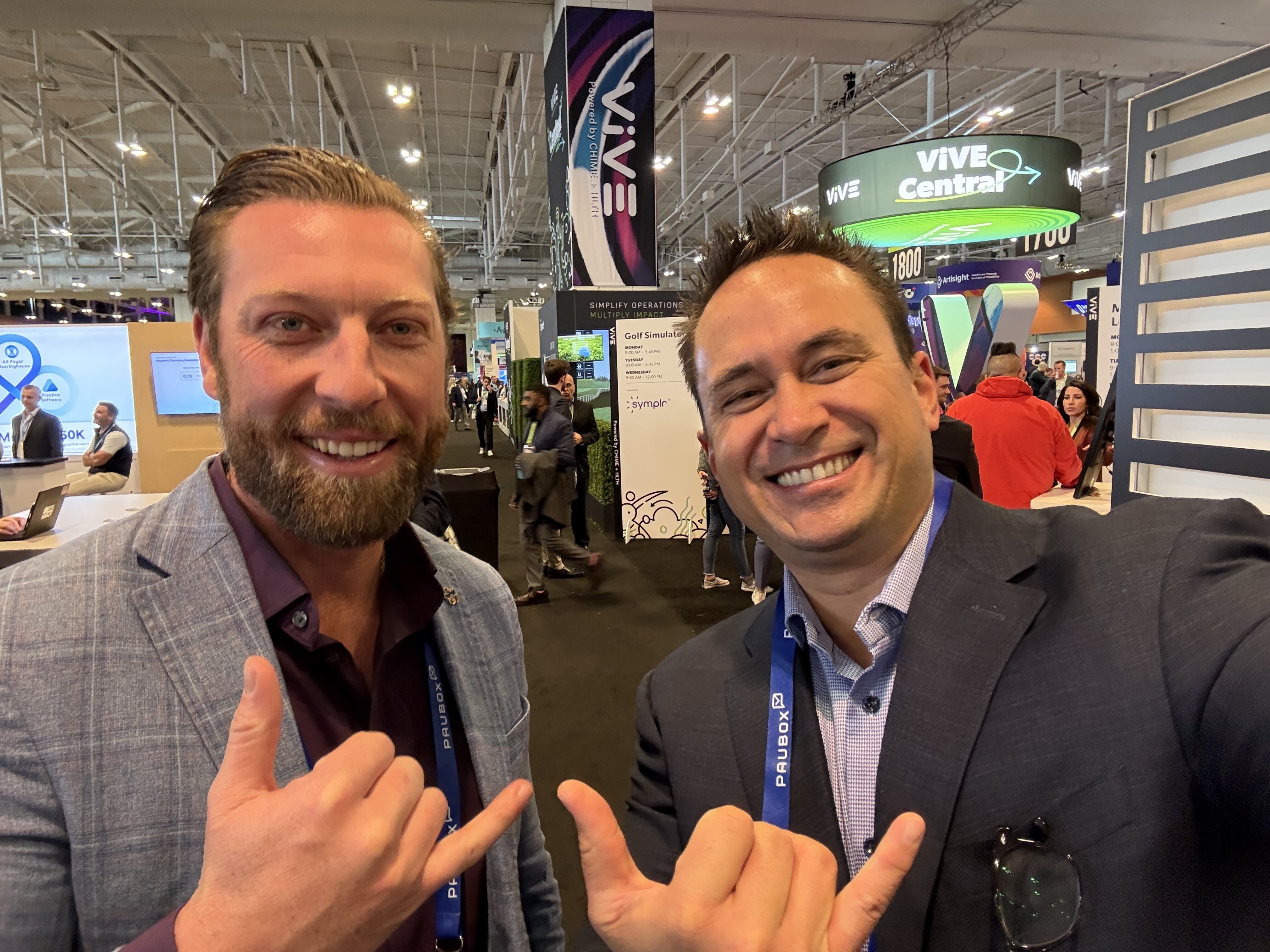 Selfie with Greg Hoffman. We've come a long way since carrying since staging fake interviews on the conference floor | Visiting customers at ViVE Nashville 2025