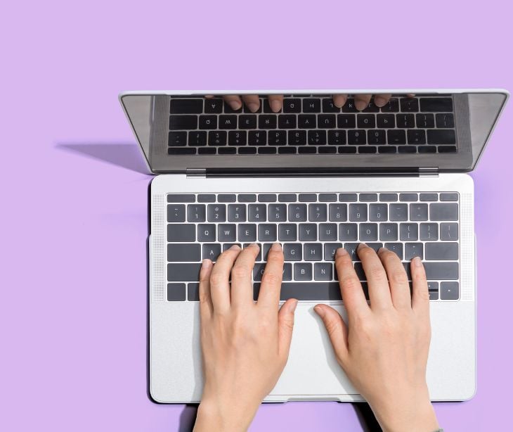 hands on a laptop keyboard