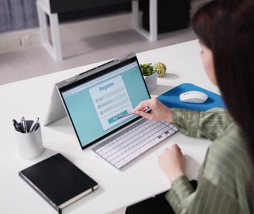 woman on computer for post When do forms need to be HIPAA compliant