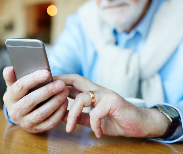 man texting on smartphone