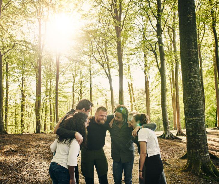 a group standing in the woods